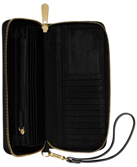 michael kors jet set travel crossgrain continental black wallet|Michael Kors continental wristlet.